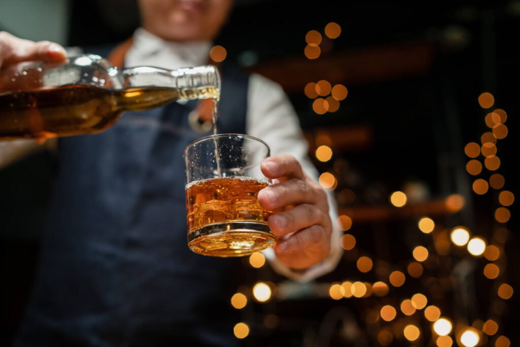 Businessmen in suits drinking Celebrate whiskey